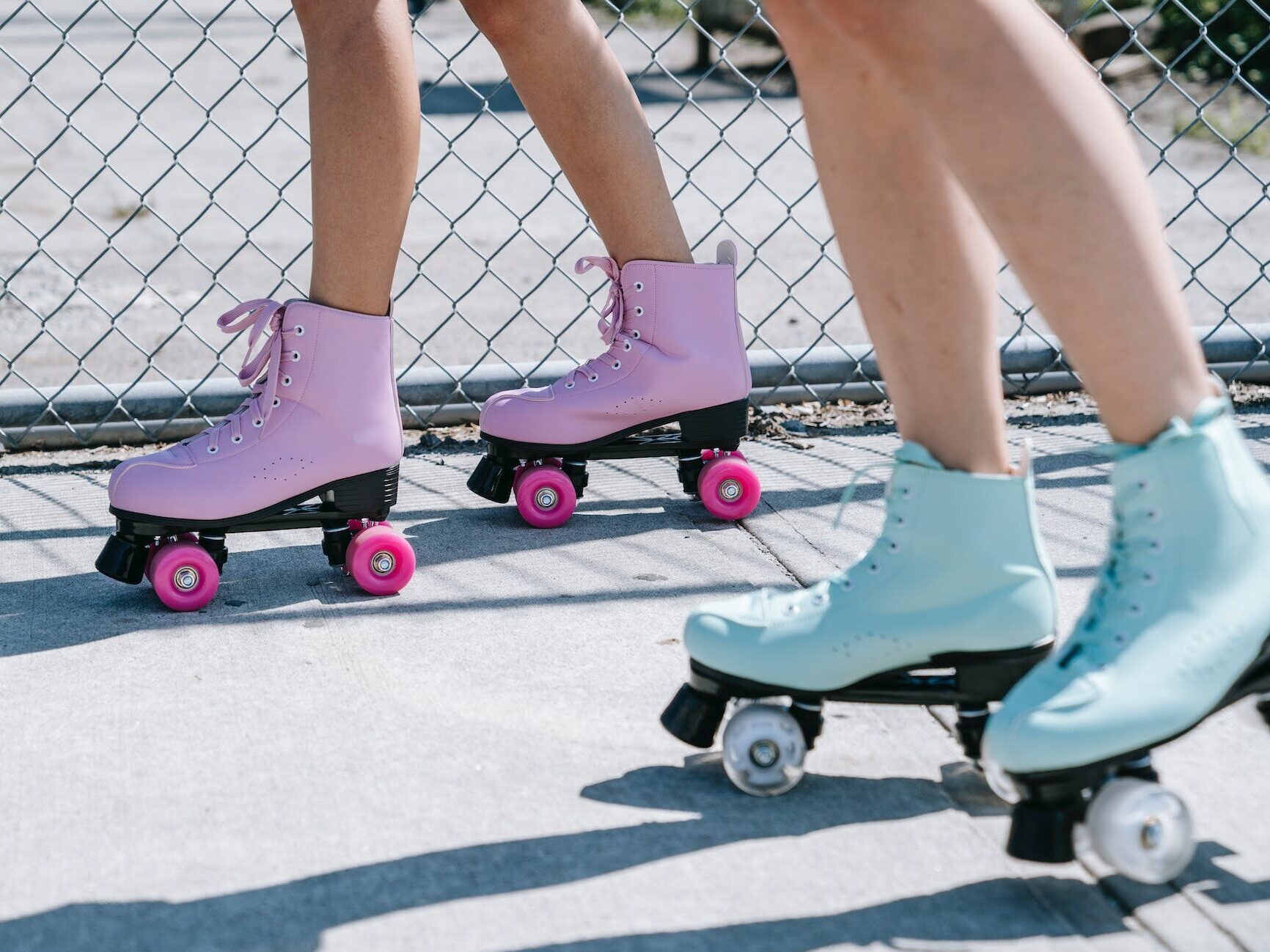 Close up of pink and blue roller skates
