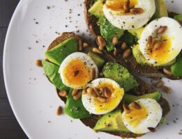 Avocado toast with hard boiled eggs on top