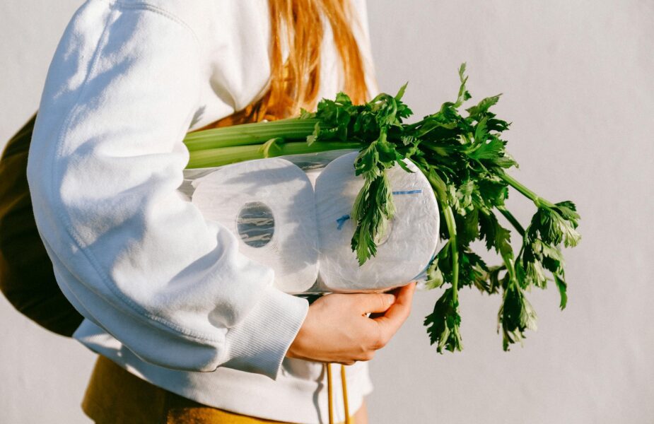 Person carrying celery